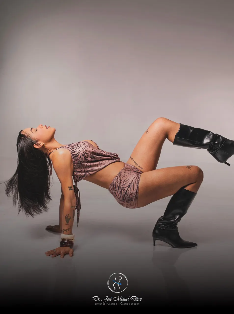 A patient of Dr. José Miguel Díaz in an arched pose during a studio session.